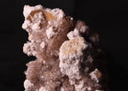 Front view of Oyelite with Calcite mineral specimen from N'Chwaning II, Kalahari Manganese Fields, South Africa