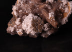 Close-up view of Oyelite with Calcite mineral specimen from N'Chwaning II, Kalahari Manganese Fields, South Africa