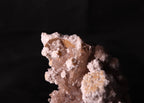Close-up view of Oyelite with Calcite mineral specimen from N'Chwaning II, Kalahari Manganese Fields, South Africa