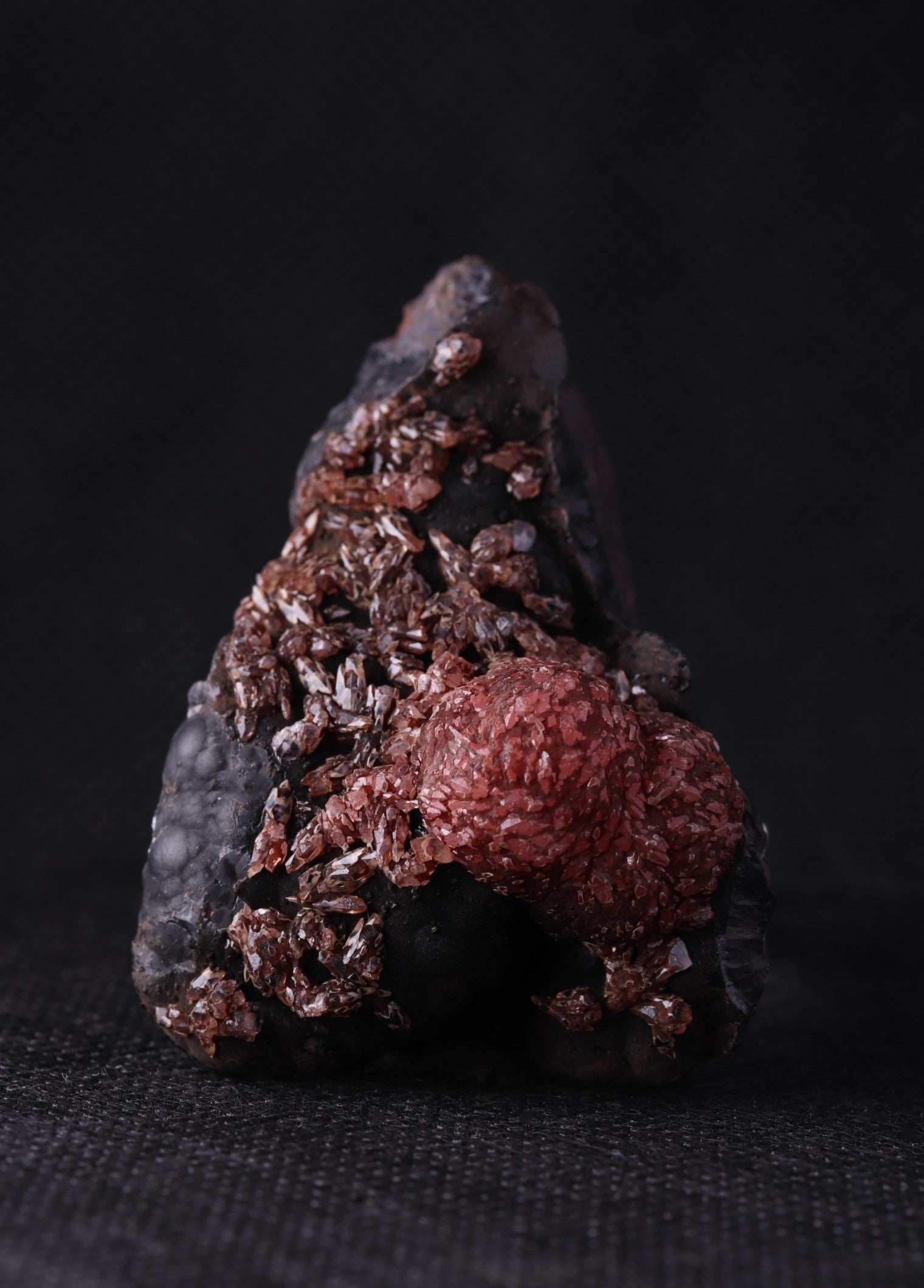 Front view of an unusual but aesthetic Rhodochrosite mineral specimen formation from Kalahari Manganese Fields, South Africa