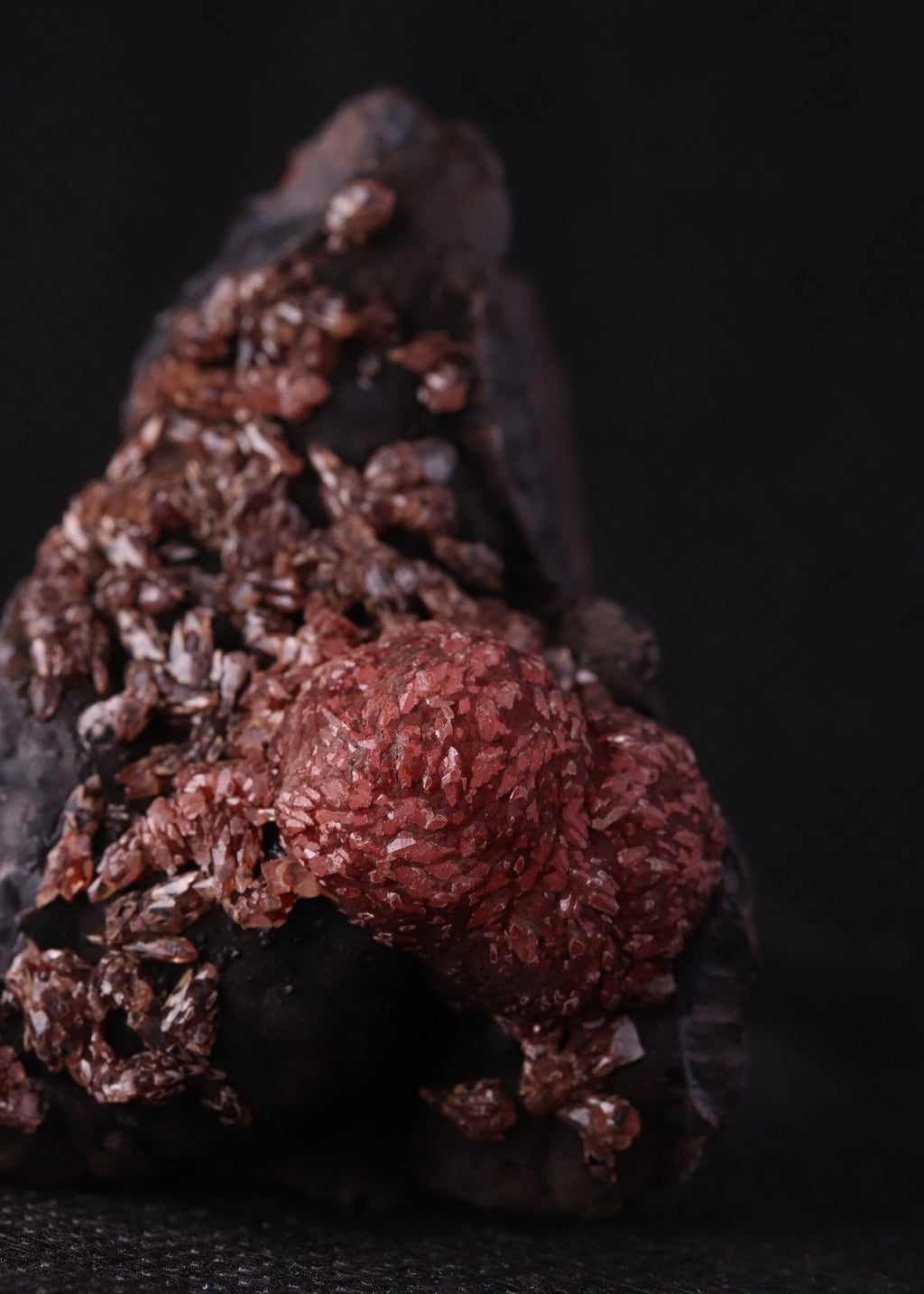 Close-up view of an unusual but aesthetic Rhodochrosite mineral specimen formation from Kalahari Manganese Fields, South Africa