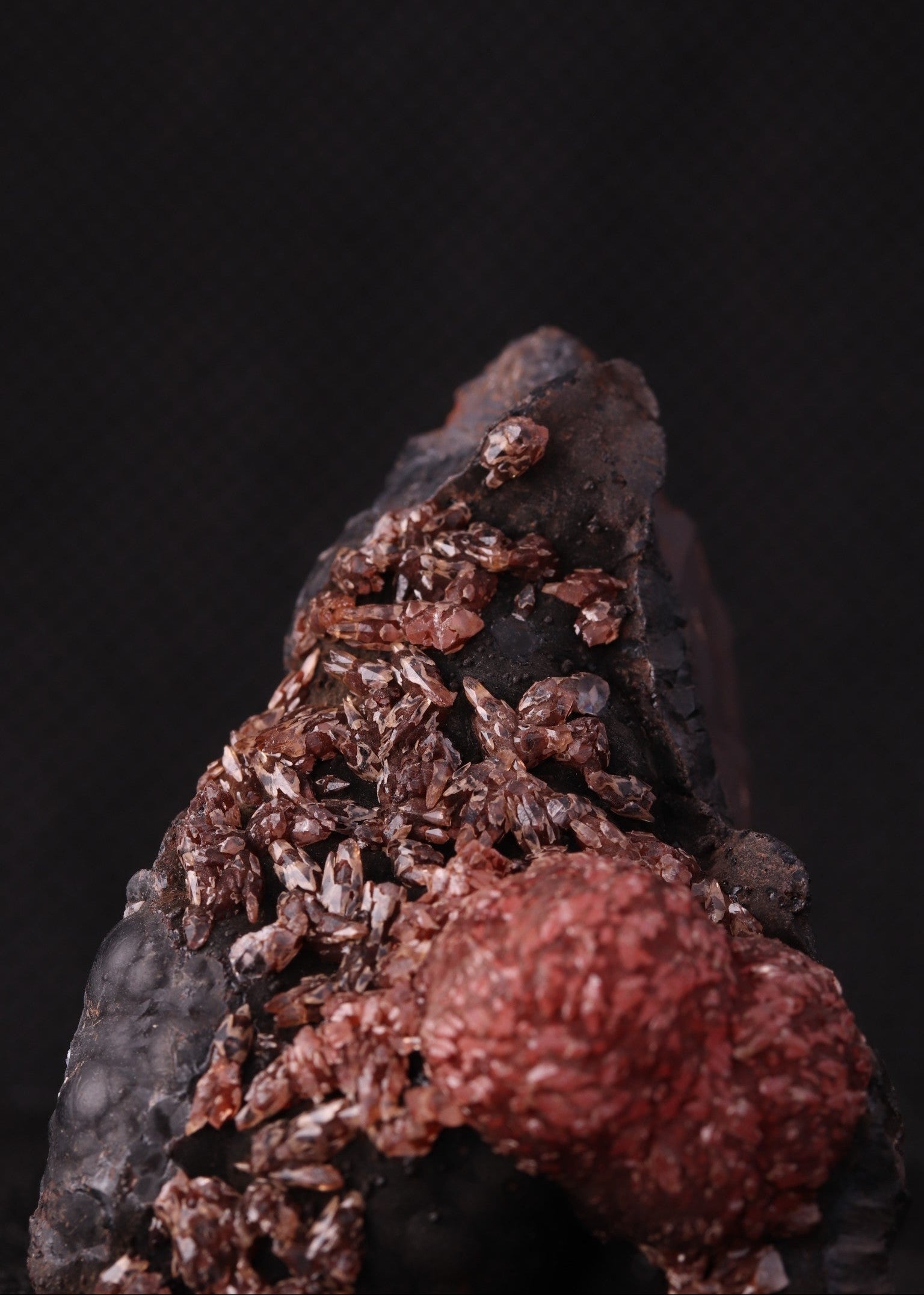Close-up view of an unusual but aesthetic Rhodochrosite mineral specimen formation from Kalahari Manganese Fields, South Africa