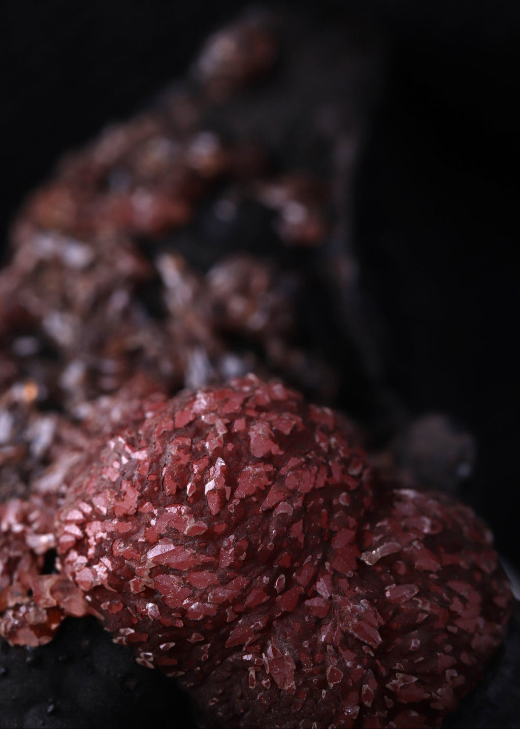Super close-up view of an unusual but aesthetic Rhodochrosite mineral specimen formation from Kalahari Manganese Fields, South Africa