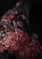 Super close-up view of an unusual but aesthetic Rhodochrosite mineral specimen formation from Kalahari Manganese Fields, South Africa