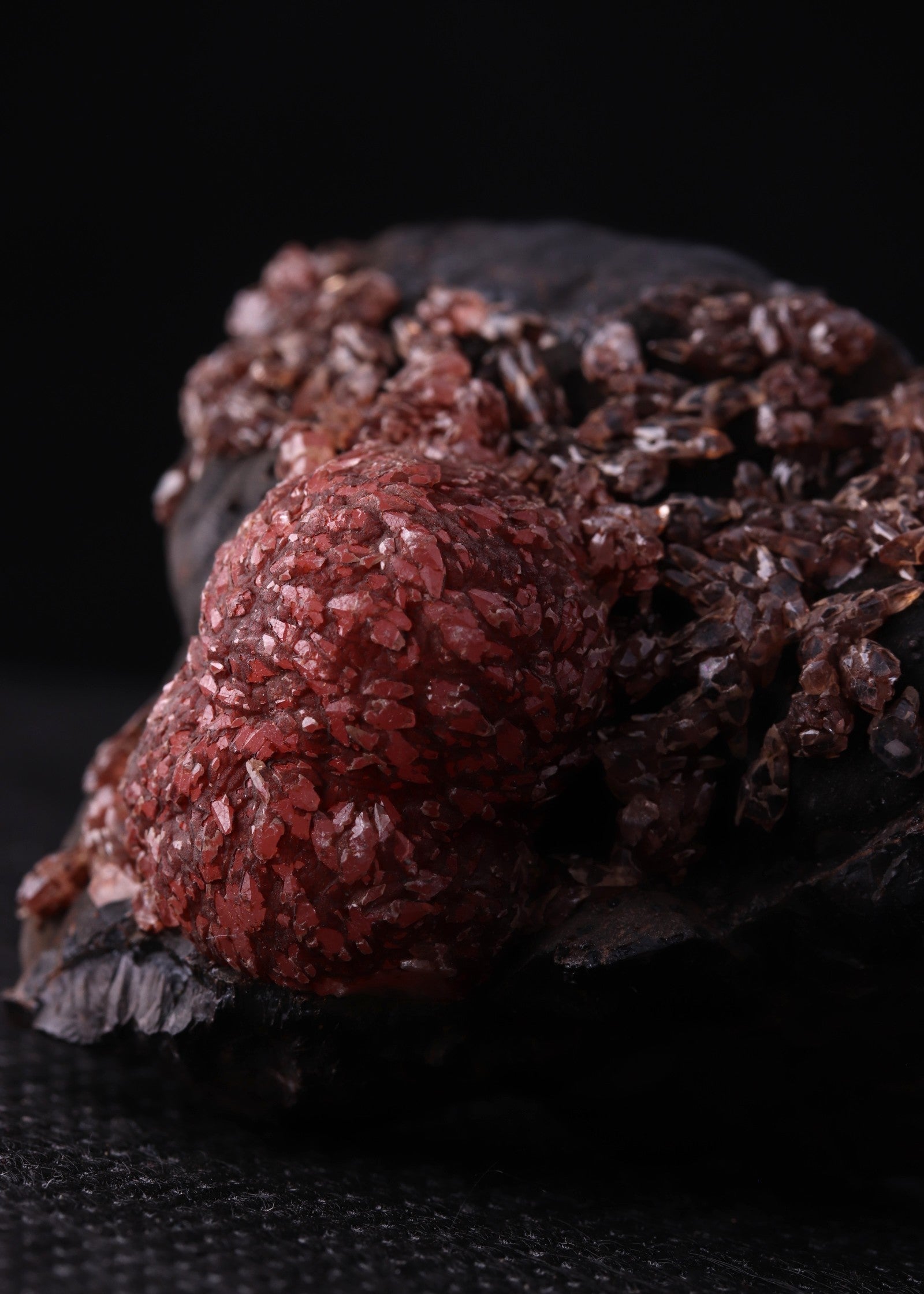 Side close-up view of an unusual but aesthetic Rhodochrosite mineral specimen formation from Kalahari Manganese Fields, South Africa