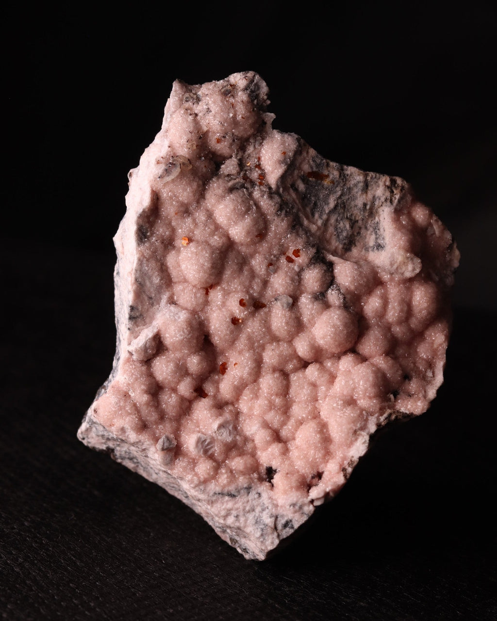 Front view of light pink Rhodochrosite with Shigaite from Kalahari Manganese Fields, South Africa. 