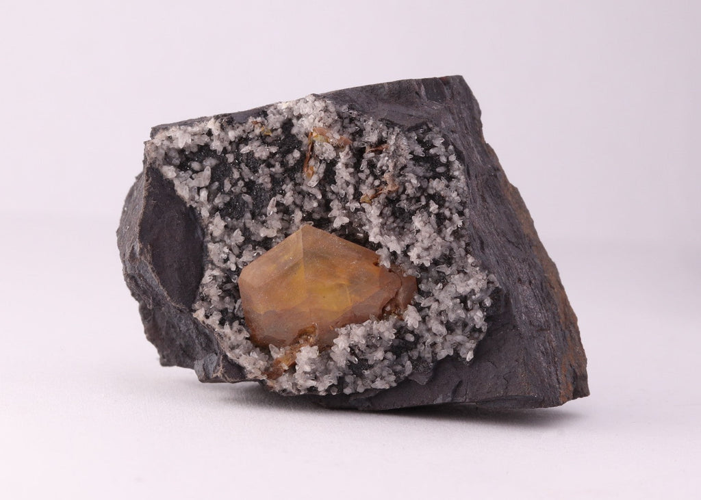 Front view of large Sturmanite crystal with Calcite on matrix from KMF (Kalahari Manganese Field), South Africa