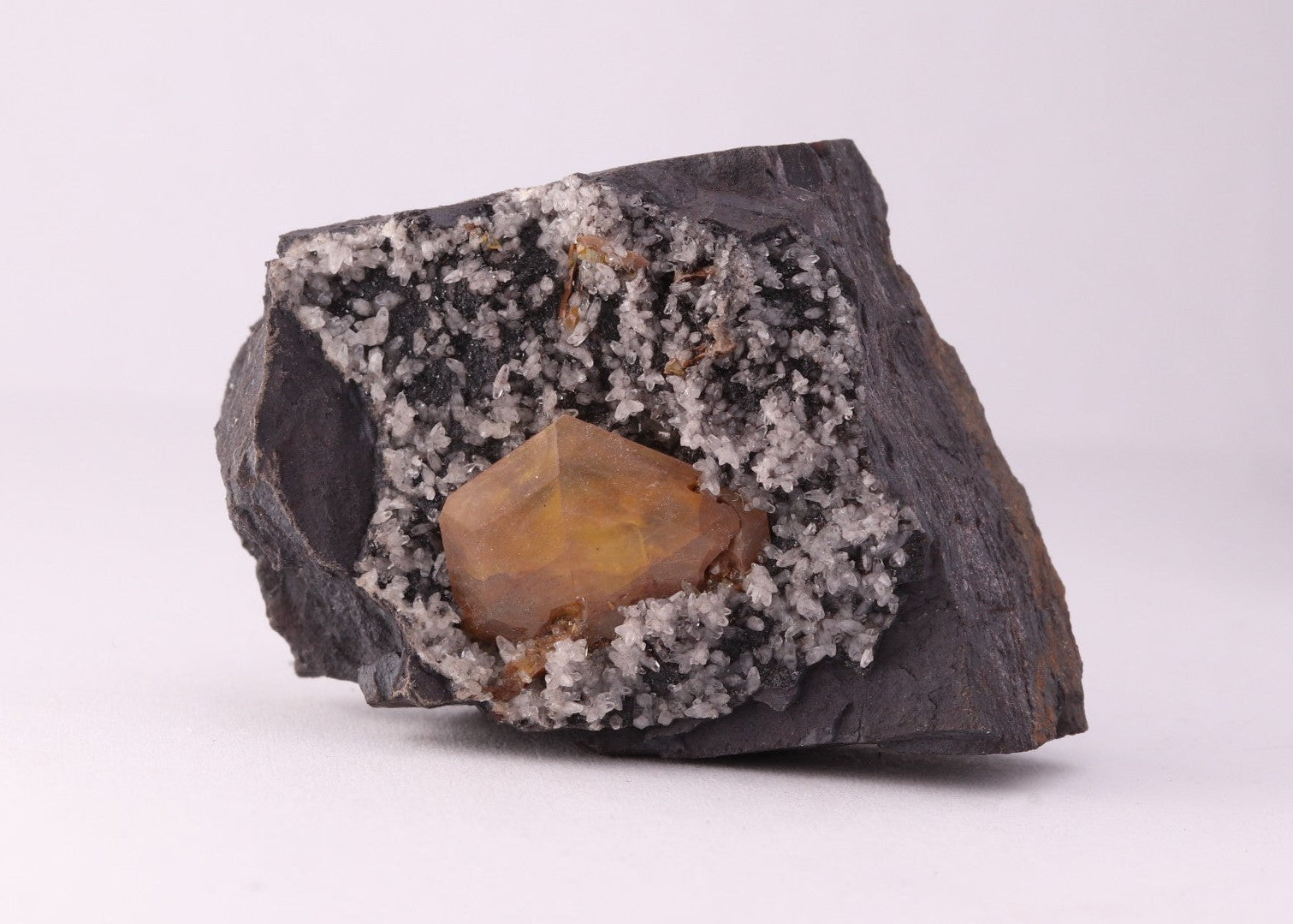Front view of large Sturmanite crystal with Calcite on matrix from KMF (Kalahari Manganese Field), South Africa