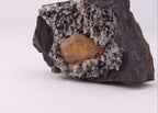 Close up of view of large gemmy Sturmanite crystal with Calcite on matrix from KMF (Kalahari Manganese Field), South Africa.