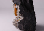 Very close-up side view of large gemmy Sturmanite crystal with Calcite on matrix from KMF (Kalahari Manganese Field), South Africa.