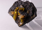 Close-up view of light shining through gemmy Sturmanite crystals on matrix. From KMF (Kalahari Manganese Field), South Africa.